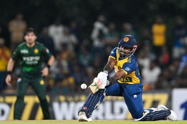 Sri Lanka's Charith Asalanka plays a shot during the third and final Twenty20 international cricket match between Pakistan and Sri Lanka at the Rangiri Dambulla International Stadium in Dambulla on January 11, 2026. (Photo by Ishara S. KODIKARA / AFP)