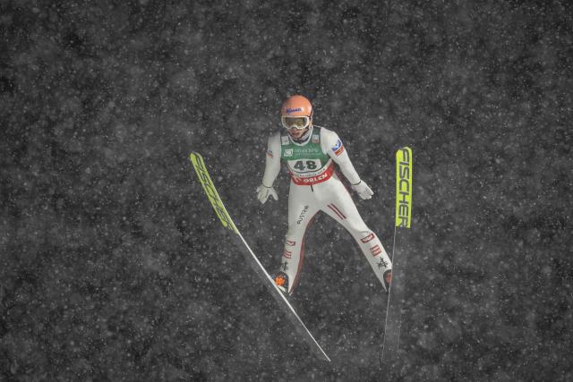 Austria's Jan Hoerl soars through the air during the Men's Large Hill HS140 event of the FIS Ski Jumping World Cup in Zakopane, Poland on January 11, 2026. (Photo by Wojtek RADWANSKI / AFP)