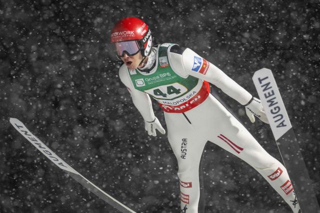 Austria's Manuel Fettner soars through the air during the Men's Large Hill HS140 event of the FIS Ski Jumping World Cup in Zakopane, Poland on January 11, 2026. (Photo by Wojtek RADWANSKI / AFP)