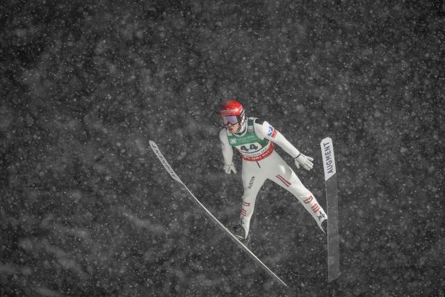 Austria's Manuel Fettner soars through the air during the Men's Large Hill HS140 event of the FIS Ski Jumping World Cup in Zakopane, Poland on January 11, 2026. (Photo by Wojtek RADWANSKI / AFP)