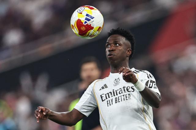 Real Madrid's Brazilian forward #07 Vinicius Junior heads the ball during the Spanish Super Cup final football match between FC Barcelona and Real Madrid at the King Abdullah Stadium in Jeddah on January 11, 2026. (Photo by Fadel SENNA / AFP)