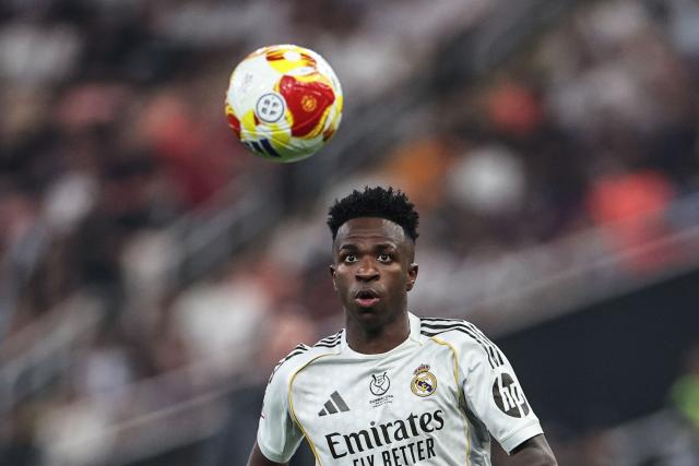 Real Madrid's Brazilian forward #07 Vinicius Junior eyes the ball during the Spanish Super Cup final football match between FC Barcelona and Real Madrid at the King Abdullah Stadium in Jeddah on January 11, 2026. (Photo by Fadel SENNA / AFP)