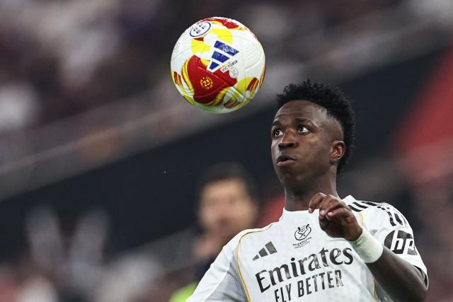 Real Madrid's Brazilian forward #07 Vinicius Junior eyes the ball during the Spanish Super Cup final football match between FC Barcelona and Real Madrid at the King Abdullah Stadium in Jeddah on January 11, 2026. (Photo by Fadel SENNA / AFP)