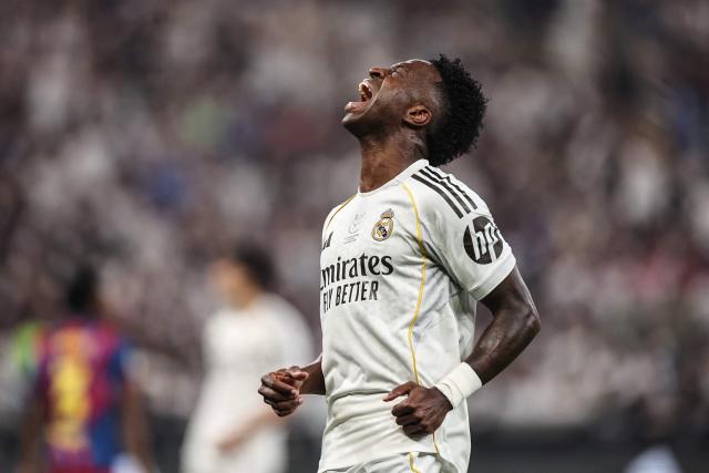 Real Madrid's Brazilian forward #07 Vinicius Junior reacts after missing a goal during the Spanish Super Cup final football match between FC Barcelona and Real Madrid at the King Abdullah Stadium in Jeddah on January 11, 2026. (Photo by Fadel SENNA / AFP)