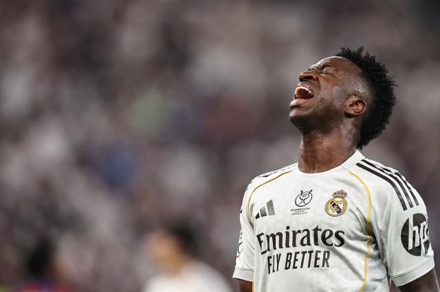 Real Madrid's Brazilian forward #07 Vinicius Junior reacts after missing a goal during the Spanish Super Cup final football match between FC Barcelona and Real Madrid at the King Abdullah Stadium in Jeddah on January 11, 2026. (Photo by Fadel SENNA / AFP)