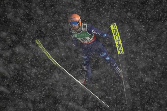 German Pius Paschke soars through the air during the Men's Large Hill HS140 event of the FIS Ski Jumping World Cup in Zakopane, Poland on January 11, 2026. (Photo by Wojtek RADWANSKI / AFP)