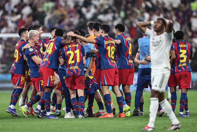 Barcelona's players celebrate after winning the Spanish Super Cup final football match between FC Barcelona and Real Madrid at the King Abdullah Stadium in Jeddah on January 11, 2026. (Photo by Fadel SENNA / AFP)