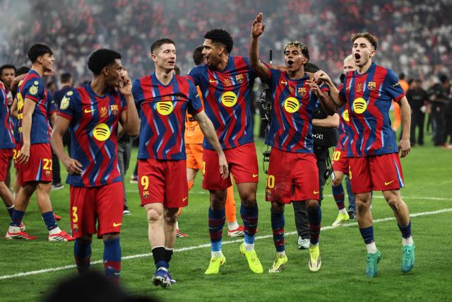 Barcelona's players celebrate after winning the Spanish Super Cup final football match between FC Barcelona and Real Madrid at the King Abdullah Stadium in Jeddah on January 11, 2026. (Photo by Fadel SENNA / AFP)