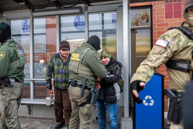 US Customs and Border Protection agents arrest a man after not providing documents proving he’s a citizen of the United States while patrolling a neighborhood during immigration enforcement activity in Minneapolis in Minneapolis, Minnesota, on January 11, 2026. A US Immigration and Customs Enforcement (ICE) agent shot and killed 37-year-old Renee Nicole Good on the streets of Minneapolis on January 7, leading to huge protests and outrage from local leaders who rejected White House claims she was a domestic terrorist. (Photo by Kerem YUCEL / AFP)
