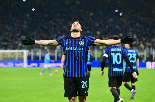 Inter Milan's Turkish midfielder #20 Hakan Calhanoglu celebrates scoring his team's second goal on a penalty kick during the Italian Serie A football match between Inter Milan and Napoli at San Siro stadium in Milan, on January 11, 2026. (Photo by Stefano RELLANDINI / AFP)