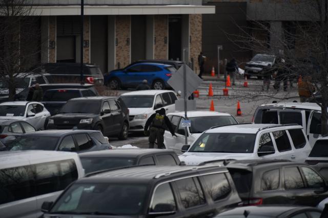 US Customs and Border Protection agents are staged at the Bishop Whipple Federal Building in Minneapolis in Minneapolis, Minnesota, on January 11, 2026. A US Immigration and Customs Enforcement (ICE) agent shot and killed 37-year-old Renee Nicole Good on the streets of Minneapolis on January 7, leading to huge protests and outrage from local leaders who rejected White House claims she was a domestic terrorist. (Photo by Octavio JONES / AFP)