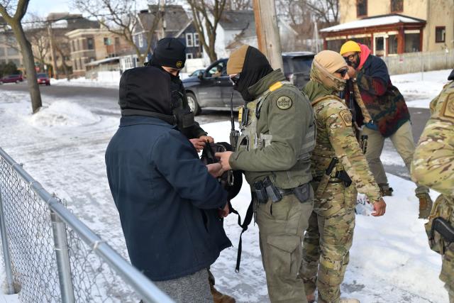 US Customs and Border Protection arrest a man after not providing documents proving he’s a US citizen while patrolling a neighborhood during immigration enforcement activity in Minneapolis in Minneapolis, Minnesota, on January 11, 2026. A US Immigration and Customs Enforcement (ICE) agent shot and killed 37-year-old Renee Nicole Good on the streets of Minneapolis on January 7, leading to huge protests and outrage from local leaders who rejected White House claims she was a domestic terrorist. (Photo by Octavio JONES / AFP)