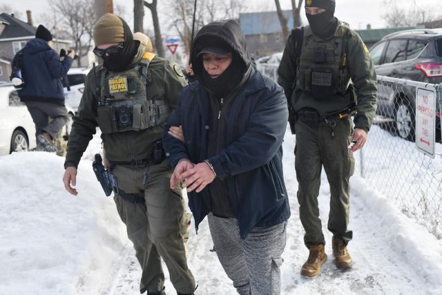 US Customs and Border Protection agents arrest a man after not providing documents proving he’s a citizen of the United States while patrolling a neighborhood during immigration enforcement activity in Minneapolis in Minneapolis, Minnesota, on January 11, 2026. A US Immigration and Customs Enforcement (ICE) agent shot and killed 37-year-old Renee Nicole Good on the streets of Minneapolis on January 7, leading to huge protests and outrage from local leaders who rejected White House claims she was a domestic terrorist. (Photo by Octavio JONES / AFP)