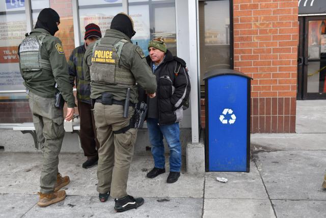 US Customs and Border Protection agents questions a man asking if he’s a U.S. citizen while patrolling a neighborhood during immigration enforcement activity in Minneapolis in Minneapolis, Minnesota, on January 11, 2026. A US Immigration and Customs Enforcement (ICE) agent shot and killed 37-year-old Renee Nicole Good on the streets of Minneapolis on January 7, leading to huge protests and outrage from local leaders who rejected White House claims she was a domestic terrorist. (Photo by Octavio JONES / AFP)