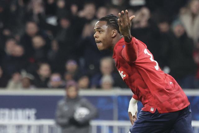 Lille's Belgian defender #03 Nathan Ngoy celebrates scoring his team's first goal during the French Cup round of 32 football match between Lille OSC and Olympique Lyonnais at the Stade Pierre-Mauroy in Villeneuve-d'Ascq, northern France on January 11, 2026. (Photo by Francois LO PRESTI / AFP)