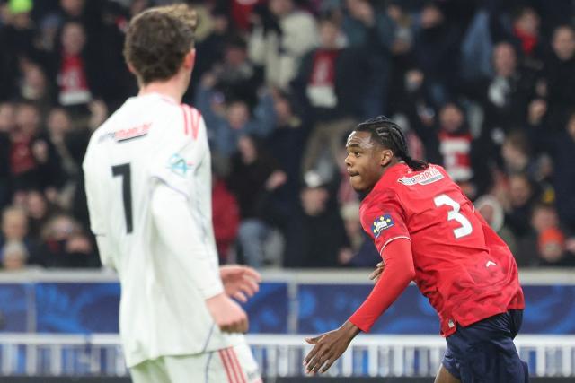 Lille's Belgian defender #03 Nathan Ngoy celebrates scoring his team's first goal during the French Cup round of 32 football match between Lille OSC and Olympique Lyonnais at the Stade Pierre-Mauroy in Villeneuve-d'Ascq, northern France on January 11, 2026. (Photo by Francois LO PRESTI / AFP)