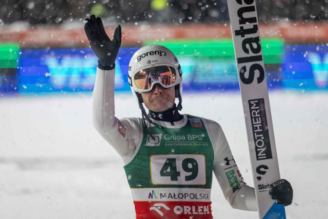 Winner Slovenia's Anze Lanisek celebrates after his final jump during the Men's Large Hill HS140 event of the FIS Ski Jumping World Cup in Zakopane, Poland on January 11, 2026. Slovenia's Anze Lanisek won the event ahead of Austria's Jan Hoerl and Austria's Manuel Fettner. (Photo by Wojtek RADWANSKI / AFP)