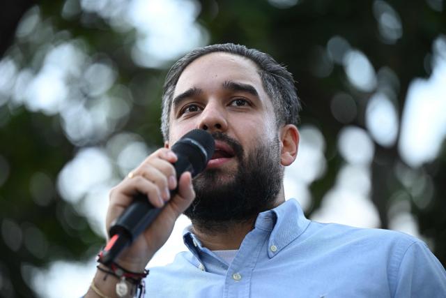 Deputy Nicolas Maduro Guerra, son of ousted President Nicolas Maduro, speaks during a rally by Evangelical faithfuls in support of his father and Cilia Flores at Plaza Bolivar in Caracas on January 11, 2026.  (Photo by Federico PARRA / AFP)