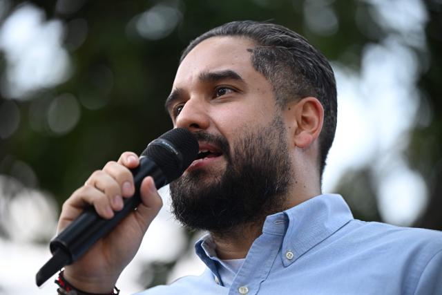 Deputy Nicolas Maduro Guerra, son of ousted President Nicolas Maduro, speaks during a rally by Evangelical faithfuls in support of his father and Cilia Flores at Plaza Bolivar in Caracas on January 11, 2026.  (Photo by Federico PARRA / AFP)