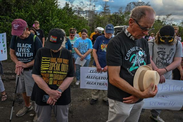 Demonstrators protest against Immigration and Customs Enforcement (ICE) and demanding the closure of the immigrant detention center known as "Alligator Alcatraz" outside the center at the Dade-Collier Training and Transition Airport in Ochopee, Florida, on January 11, 2026. A US Immigration and Customs Enforcement (ICE) agent shot and killed 37-year-old Renee Nicole Good on the streets of Minneapolis on January 7, leading to huge protests and outrage from local leaders who rejected White House claims she was a domestic terrorist. (Photo by Giorgio VIERA / AFP)