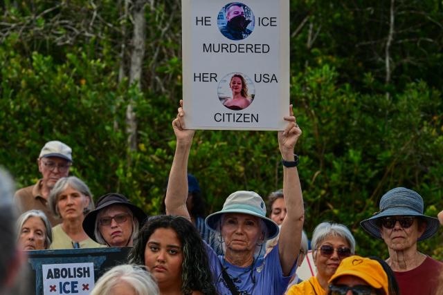 Demonstrators protest against Immigration and Customs Enforcement (ICE) and demanding the closure of the immigrant detention center known as "Alligator Alcatraz" outside the center at the Dade-Collier Training and Transition Airport in Ochopee, Florida, on January 11, 2026. A US Immigration and Customs Enforcement (ICE) agent shot and killed 37-year-old Renee Nicole Good on the streets of Minneapolis on January 7, leading to huge protests and outrage from local leaders who rejected White House claims she was a domestic terrorist. (Photo by Giorgio VIERA / AFP)