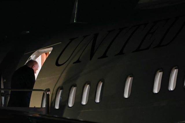 US President Donald Trump boards Air Force One as he departs from Palm Beach International Airport in West Palm Beach, Florida, on January 11, 2026. Trump is returning to the White House after spending the weekend at his Mar-a-Lago estate. (Photo by ANDREW CABALLERO-REYNOLDS / AFP)