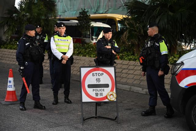 Police keep watch outside the West Kowloon Magistrates' court in Hong Kong on January 12, 2026, for the sentencing arguments of convicted pro-democracy media tycoon Jimmy Lai. A Hong Kong court will hear sentencing arguments on January 12 for pro-democracy media tycoon Jimmy Lai, who was convicted of national security crimes that could land him in prison for life. (Photo by Peter PARKS / AFP)