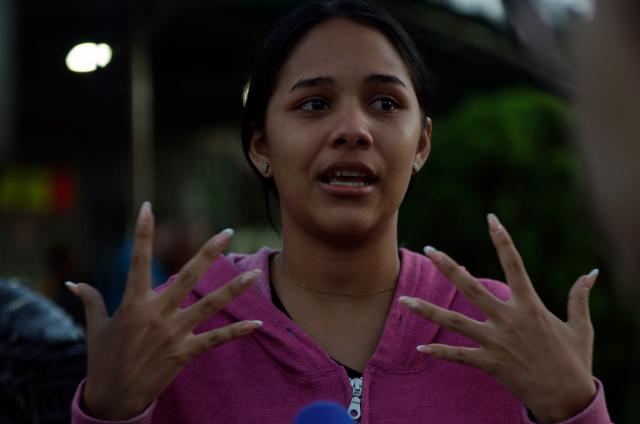 Lorealbert Gutierrez, 19, speaks while waiting for news on the release of prisoners, outside El Rodeo I prison in Guatire, Miranda State, some 30 kilometers east of Caracas on January 10, 2026. Venezuelans were waiting for more political prisoners to be released, as ousted president Nicolas Maduro defiantly claimed from his US jail cell that he is "doing fine" after being seized by US forces a week ago. (Photo by Pedro MATTEY / AFP)