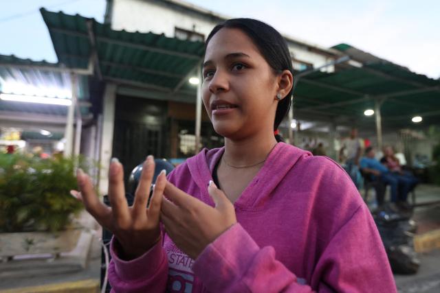 Lorealbert Gutierrez, 19, speaks while waiting for news on the release of prisoners, outside El Rodeo I prison in Guatire, Miranda State, some 30 kilometers east of Caracas on January 10, 2026. Venezuelans were waiting for more political prisoners to be released, as ousted president Nicolas Maduro defiantly claimed from his US jail cell that he is "doing fine" after being seized by US forces a week ago. (Photo by Pedro MATTEY / AFP)