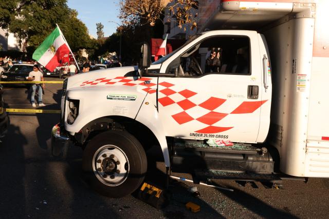 A U-Haul truck that reportedly was driven into a crowd is pictured during a “Free Iran” rally in Los Angeles, California, on January 11, 2026. The Norway-based NGO Iran Human Rights (IHR) said it had confirmed the killing of at least 192 protesters but warned the actual death toll could already amount to several hundreds, or even more. The IHR has an extensive network of sources in the country. The protests, initially sparked by anger over the rising cost of living, have evolved into a movement against the theocratic system in place in Iran since the 1979 revolution. They have already lasted two weeks. (Photo by Jonathan Alcorn / AFP)