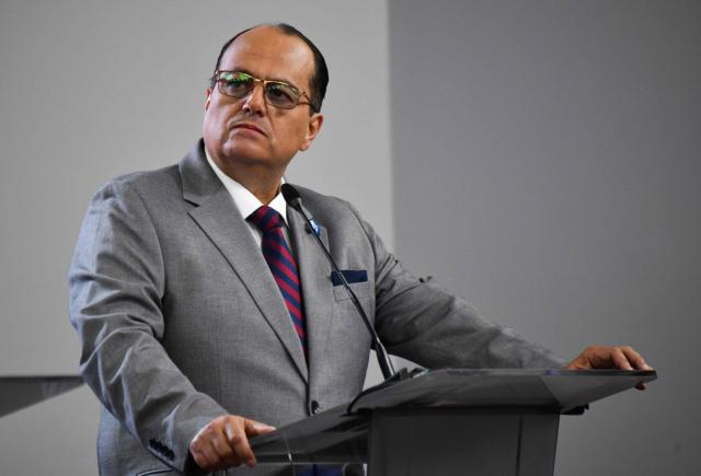 Costa Rica's Presidential candidate Claudio Alpizar Otoya, of the National Hope Party, speaks during the debate at the Supreme Electoral Tribunal (TSE) in San Jose, Costa Rica on January 11, 2026. Costa Rica will hold presidential election on February 1. (Photo by Ezequiel BECERRA / AFP)