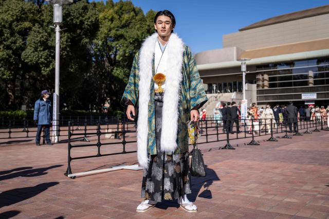 Actor Danhi Kinoshita poses for photographs before attending a ceremony at Todoroki Arena to mark "Coming of Age Day" to honour people who turn 20 this year to signify adulthood, in Kawasaki, Kanagawa prefecture on January 12, 2026. (Photo by Yuichi YAMAZAKI / AFP)