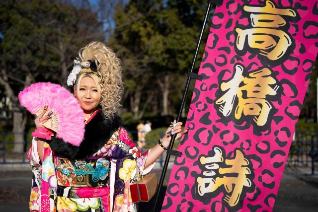 Roofer Uta Takahashi poses for photographs before attending a ceremony at Todoroki Arena to mark "Coming of Age Day" to honour people who turn 20 this year to signify adulthood, in Kawasaki, Kanagawa prefecture on January 12, 2026. (Photo by Yuichi YAMAZAKI / AFP)
