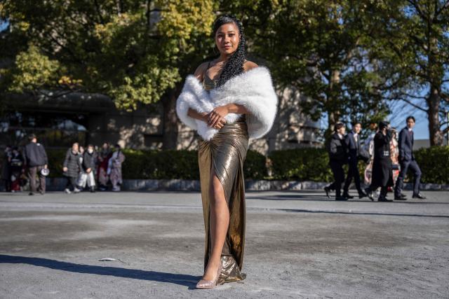College student Yumika Saito poses for photographs before attending a ceremony at Todoroki Arena to mark "Coming of Age Day" to honour people who turn 20 this year to signify adulthood, in Kawasaki, Kanagawa prefecture on January 12, 2026. (Photo by Yuichi YAMAZAKI / AFP)