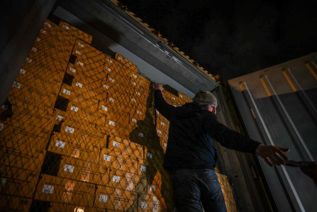 French farmers stop drivers to inspect transport of foreign products, as part of national protests against the EU-Mercosur agreement and the government's handling of the contagious nodular dermatitis (CND) epidemic, on the harbour of Le Havre, northwestern France on January 12, 2026. (Photo by Lou BENOIST / AFP)