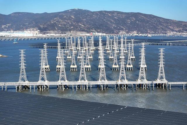 This picture taken on January 11, 2026 shows solar panels on the construction site of the CNNC Tianwan 2-million-kilowatt tidal flat photovoltaic demonstration project in Lianyungang, east China's Jiangsu province. (Photo by AFP) / China OUT