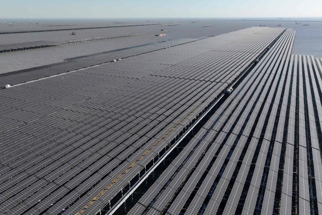 This picture taken on January 11, 2026 shows solar panels on the construction site of the CNNC Tianwan 2-million-kilowatt tidal flat photovoltaic demonstration project in Lianyungang, east China's Jiangsu province. (Photo by AFP) / China OUT