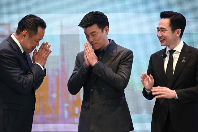 (L-R) Prime minister and Bhumjaithai Party’s party leader Anutin Charnvirakul, People’s Party’s prime ministerial candidate and party leader Natthaphong Ruengpanyawut and Pheu Thai Party’s prime ministerial candidate Yodchanan Wongsawat interact at the Global Dynamics and Thailand’s Future event at Queen Sirikit National Convention Center in Bangkok on January 12, 2026. (Photo by Lillian SUWANRUMPHA / AFP)