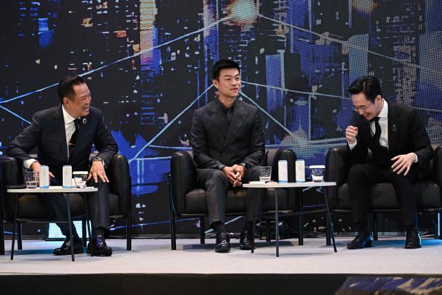 (L-R) Prime minister and Bhumjaithai Party’s party leader Anutin Charnvirakul, People’s Party’s prime ministerial candidate and party leader Natthaphong Ruengpanyawut and Pheu Thai Party’s prime ministerial candidate Yodchanan Wongsawat interact at the Global Dynamics and Thailand’s Future event at Queen Sirikit National Convention Center in Bangkok on January 12, 2026. (Photo by Lillian SUWANRUMPHA / AFP)