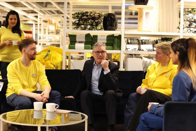 Britain's Prime Minister Keir Starmer speaks with members of staff during a visit to a branch of Swedish furniture store Ikea in Croydon, south London on January 12, 2026. (Photo by Ian Vogler / POOL / AFP)