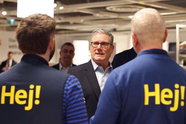 Britain's Prime Minister Keir Starmer speaks with members of staff during a visit to a branch of Swedish furniture store Ikea in Croydon, south London on January 12, 2026. (Photo by Ian Vogler / POOL / AFP)