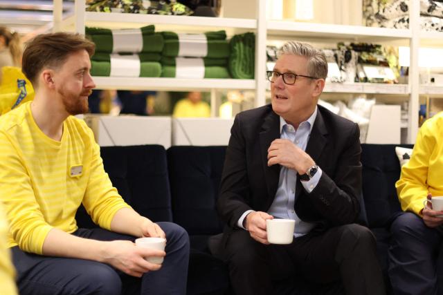 Britain's Prime Minister Keir Starmer speaks with members of staff during a visit to a branch of Swedish furniture store Ikea in Croydon, south London on January 12, 2026. (Photo by Ian Vogler / POOL / AFP)