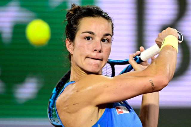 FILES) France's Lois Boisson eyes the ball as she plays a backhand return to US Coco Gauff during their women's singles semi-final match on day 12 of the French Open tennis tournament on Court Philippe-Chatrier at the Roland-Garros Complex in Paris on June 5, 2025. France's No1 player Lois Boisson (ranked 35th in the world) on January 12, 2026 withdrew from the Australian Open, the first Grand Slam of the season, which starts on January 18, 2026 in Melbourne. (Photo by JULIEN DE ROSA / AFP)
