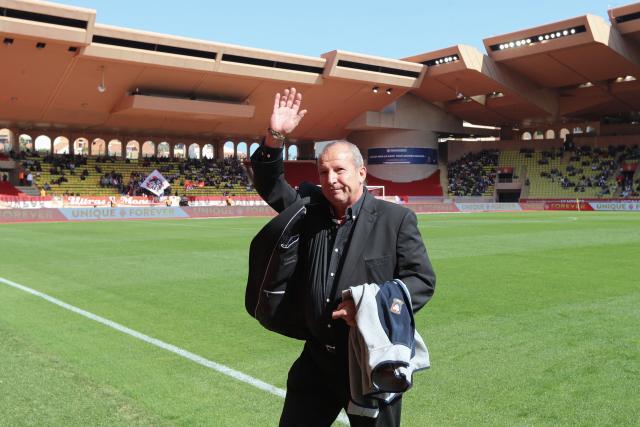 (FILES) Caen's special advisor Rolland Courbis waves to the crowd from the pitch prior to the start of the French L1 football match Monaco vs Caen on March 31, 2019 at the Louis II Stadium in Monaco. Rolland Courbis, former football player and coach, notably for Marseille and Bordeaux, has died at the age of 72, announced RMC radio on January 12, 2026, where he had been working as a consultant since 2005. (Photo by VALERY HACHE / AFP)