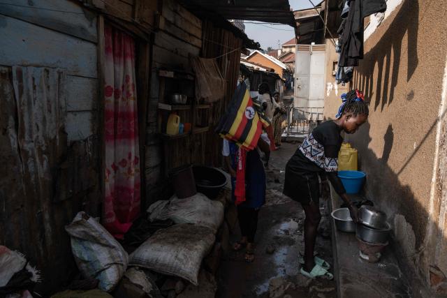 A street vendor displays Ugandan flags ahead the final campaign rally of opposition leader and presidential candidate for the National Unity Platform (NUP) Robert Kyagulanyi Ssentamu, popularly known as Bobi Wine, in Kampala, on January 12, 2026. (Photo by Badru Katumba / AFP)