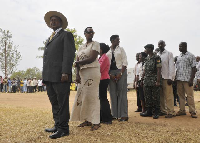 (FILES) Uganda's president Yoweri Museveni (L) stands in the line to queue before casting his vote on February 18, 2011 at a polling station in the western Ugandan town of Kiruhura, 280 kms southwest of  Kampala. Yoweri Museveni has been president longer than most Ugandans have been alive, and shows no sign of giving up his place among the world's longest-serving leaders.
Museveni says he is fighting fit and ready for a seventh term if he wins January 15, 2026's election. (Photo by Simon MAINA / AFP)