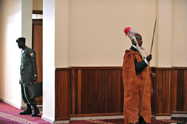 (FILES) Ugandan President Yoweri Museveni wearing traditional Toroo kingdom ceremonial head gear holds a ceremonial spear as he waits for Ugandan King Oyo Nyimba Kabamba Iguru Rukidi IV moments before  the King's coronation ceremony at the king's palace in Fort Portal, Uganda on April 17, 2010. Yoweri Museveni has been president longer than most Ugandans have been alive, and shows no sign of giving up his place among the world's longest-serving leaders.
Museveni says he is fighting fit and ready for a seventh term if he wins January 15, 2026's election. (Photo by Roberto SCHMIDT / AFP)
