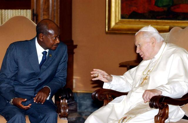 (FILES) Pope John Paul II (R) chats with President of Uganda, Yoweri Kaguta Museveni during their meeting in Vatican City, on June 11, 2002. Yoweri Museveni has been president longer than most Ugandans have been alive, and shows no sign of giving up his place among the world's longest-serving leaders.
Museveni says he is fighting fit and ready for a seventh term if he wins January 15, 2026's election. (Photo by MASSIMO SAMBUCETTI / POOL / AFP)