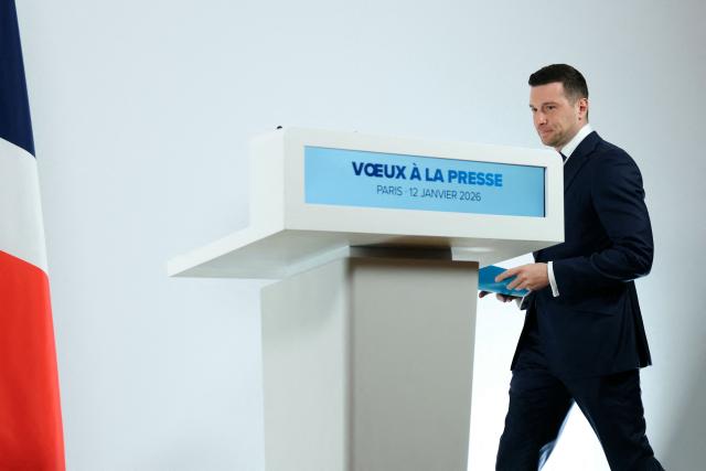 President of French far-right Rassemblement National (RN) party and Member of the European Parliament (MEP) Jordan Bardella arrives to deliver his New Year wishes to the press at the Maison de l'Amérique Latine in Paris, on January 12, 2026. (Photo by Alain JOCARD / AFP)