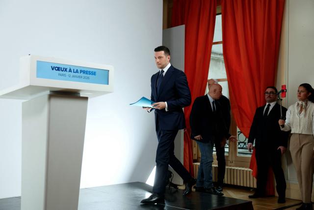 President of French far-right Rassemblement National (RN) party and Member of the European Parliament (MEP) Jordan Bardella arrives to deliver his New Year wishes to the press at the Maison de l'Amérique Latine in Paris, on January 12, 2026. (Photo by Alain JOCARD / AFP)
